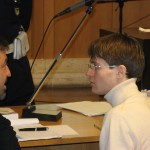 Raphael Sollecito talks with counsel during a break in the trial.